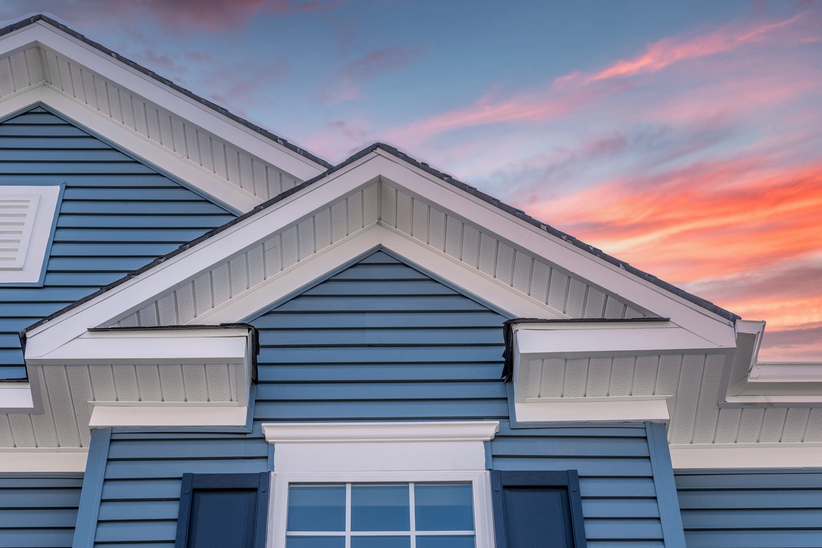 blue everlast siding at sunset
