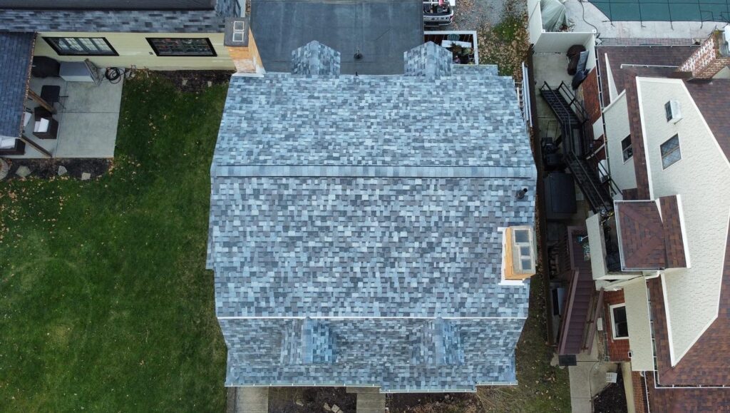 Aerial view of a house with architectural shingle roof