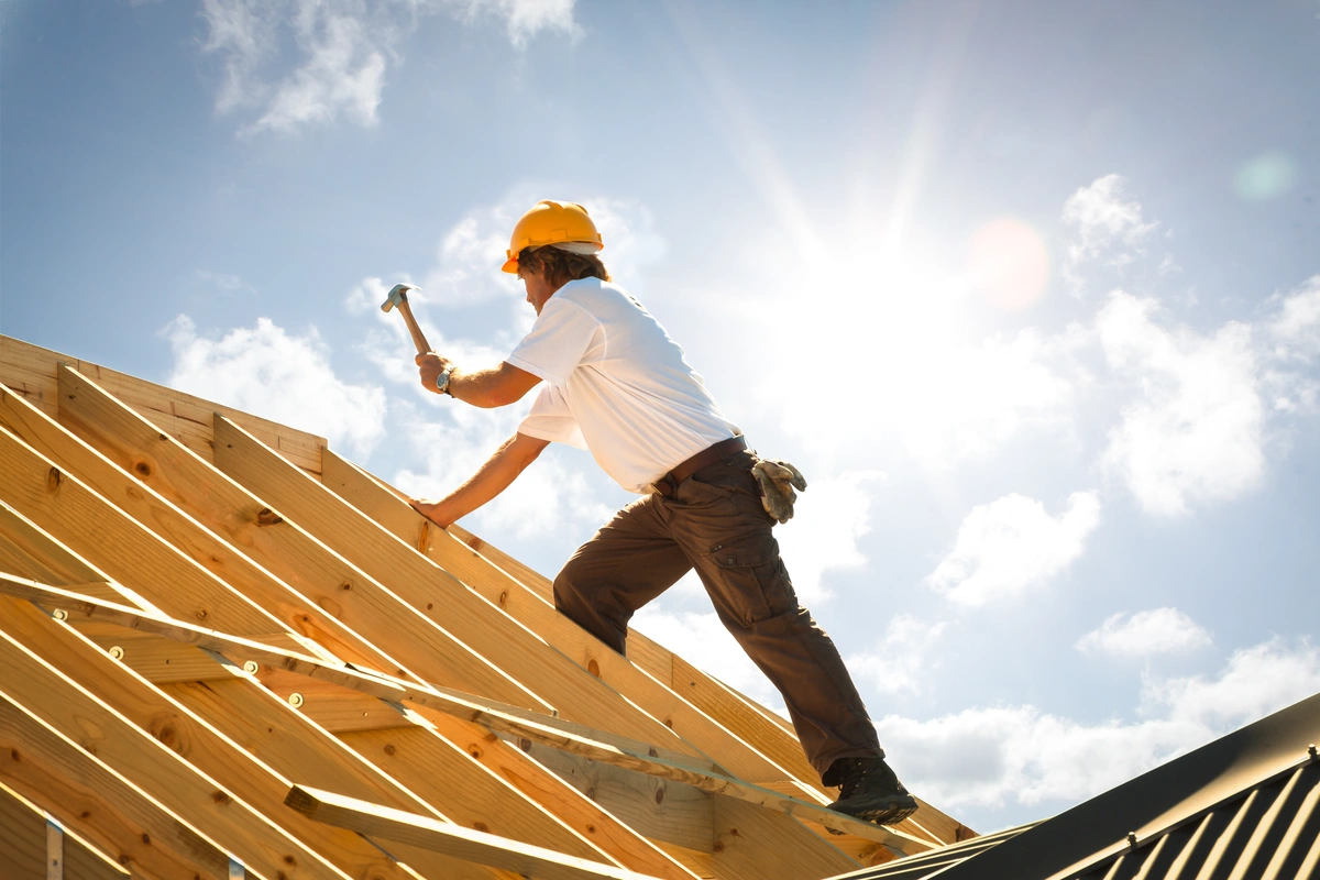 roofer against the sky
