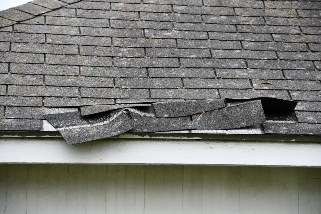 displaced roof shingles