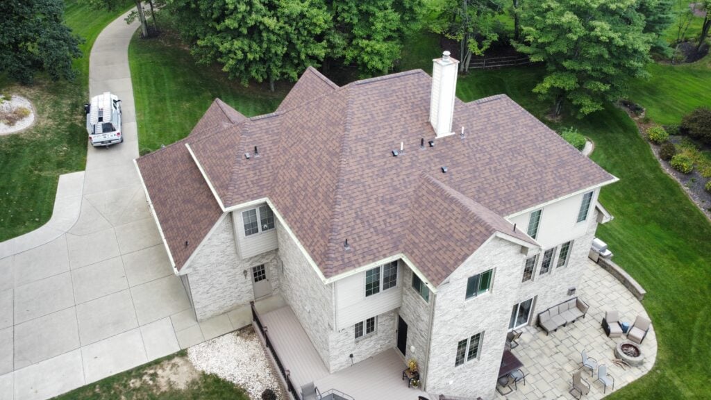 Large house with a shingle roof