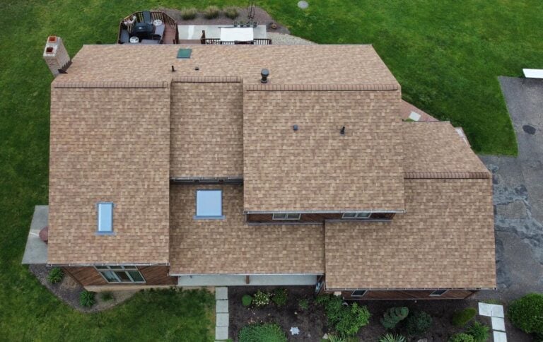 A large roof with newly installed shingles