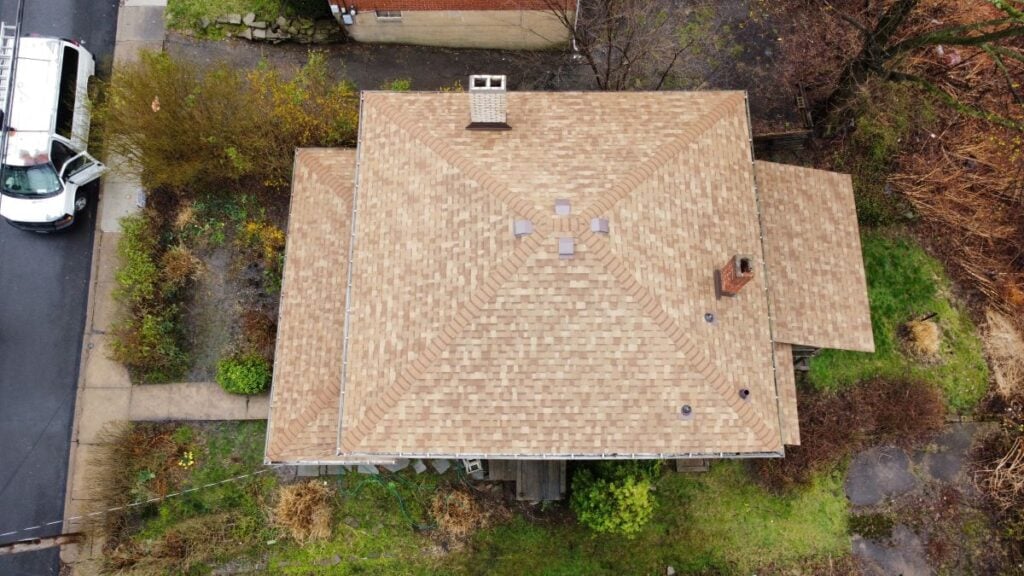 Aerial view of a tan shingle roof