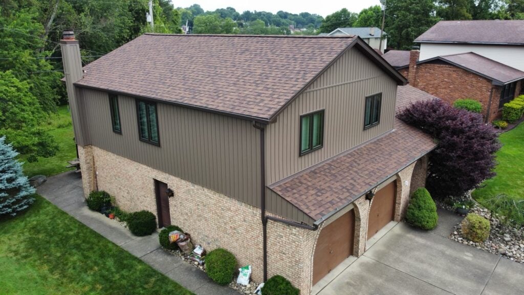 A house with a newly installed shingle roof