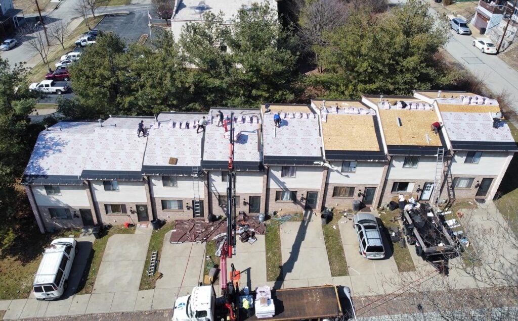 roofing companies in Allison Park multiple houses McCormick workers replacing shingles 