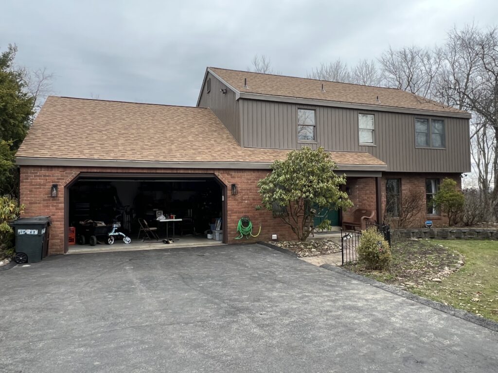 roofing companies in Cranberry Township brown house shingles roof