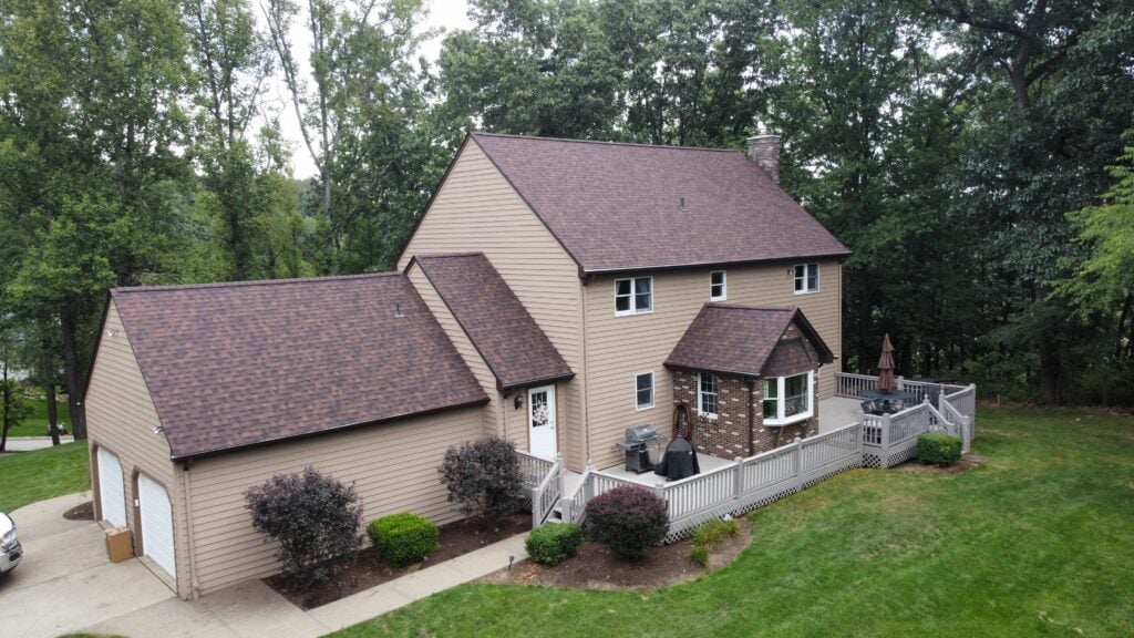 roofing companies in Allison Park red shingles roof beige siding
