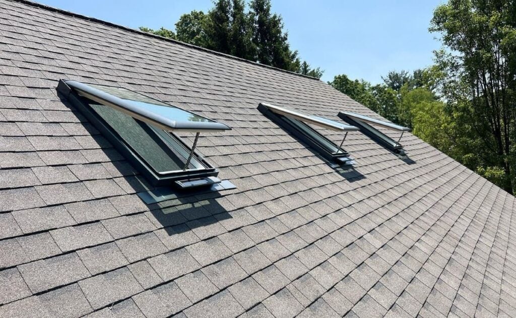 energy efficient roofing Mccormick project brown shingles small window vents
