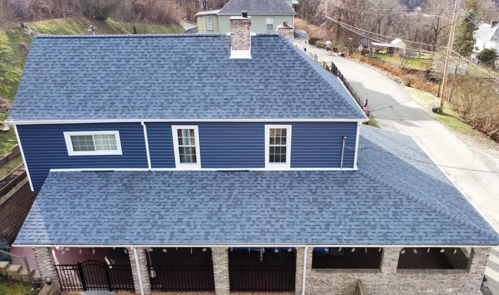 roofing companies in Wexford blue shingles blue siding and white frame windows