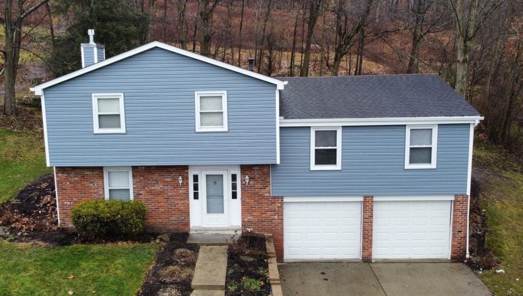 siding companies in Pittsburgh blue siding small house white garage and front doors