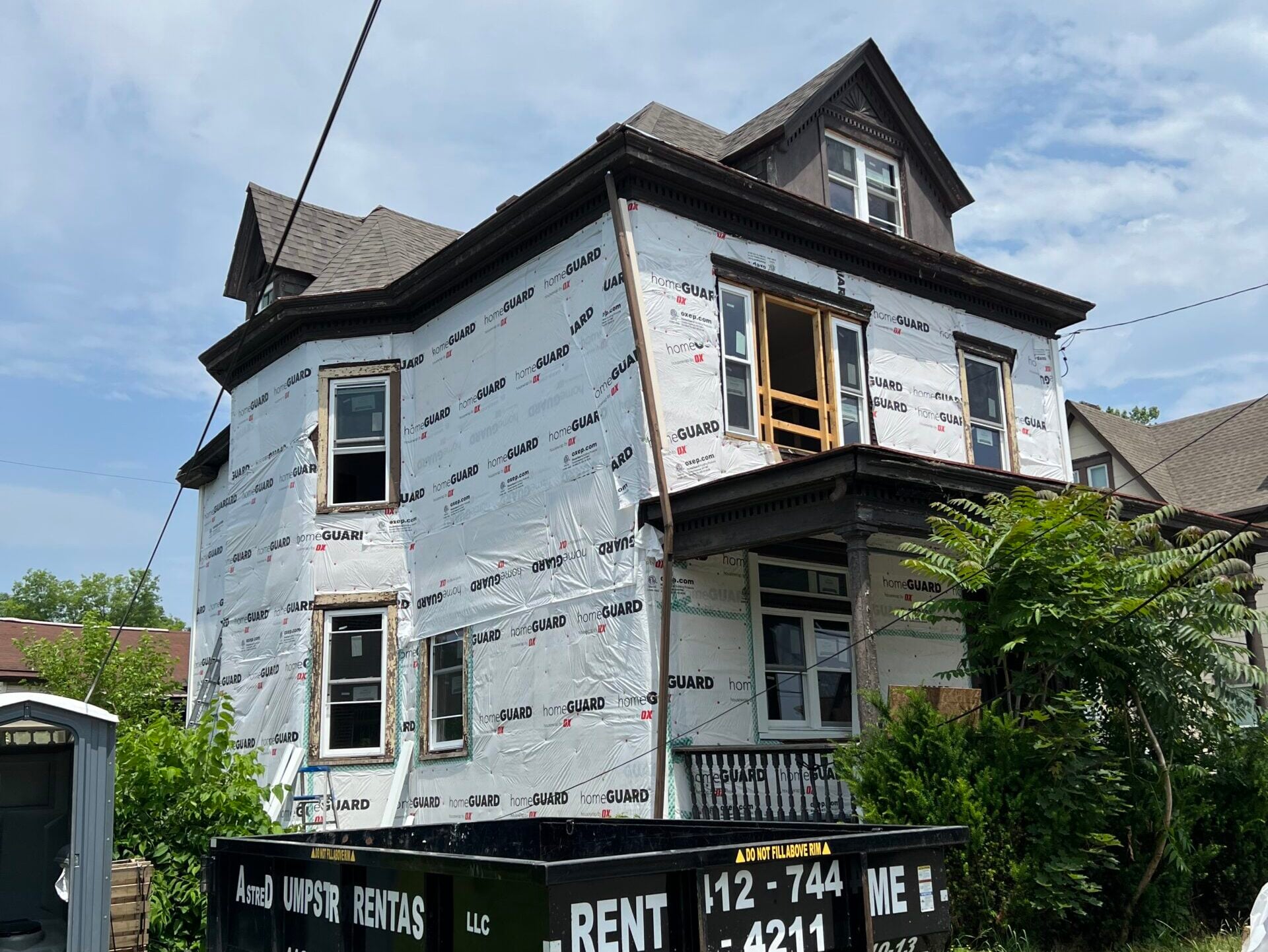 siding companies in Trafford siding replacement covered with paper
