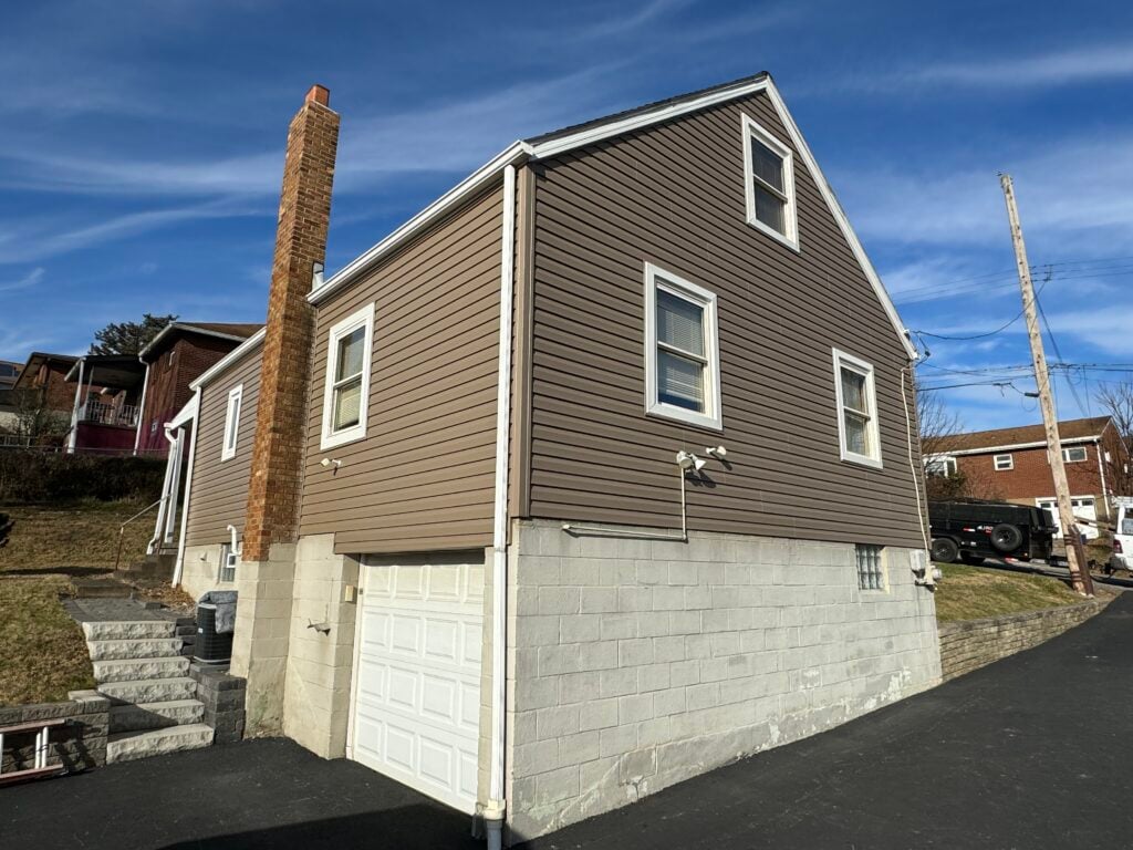 siding companies in Trafford brown siding big house white frame windows