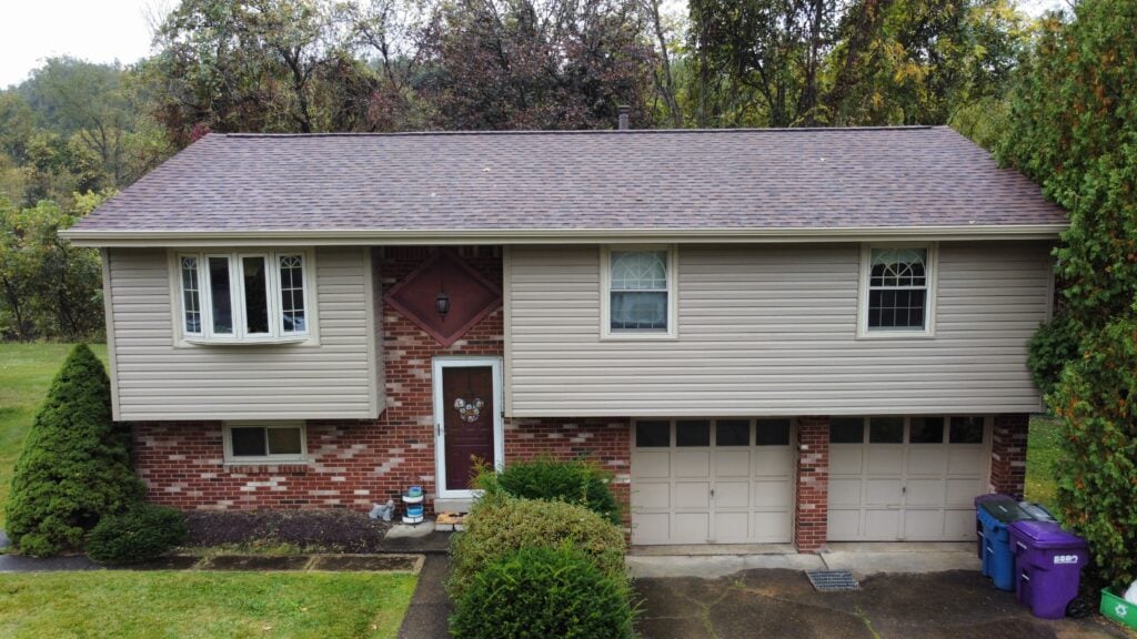 siding companies in Trafford beige siding brown shingles roof