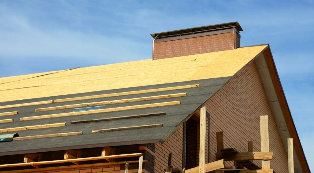 roof deck under construction brick wall big house