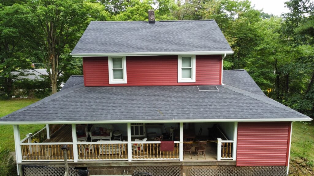 roof replacement cost Irwin red siding  house with shingles roof