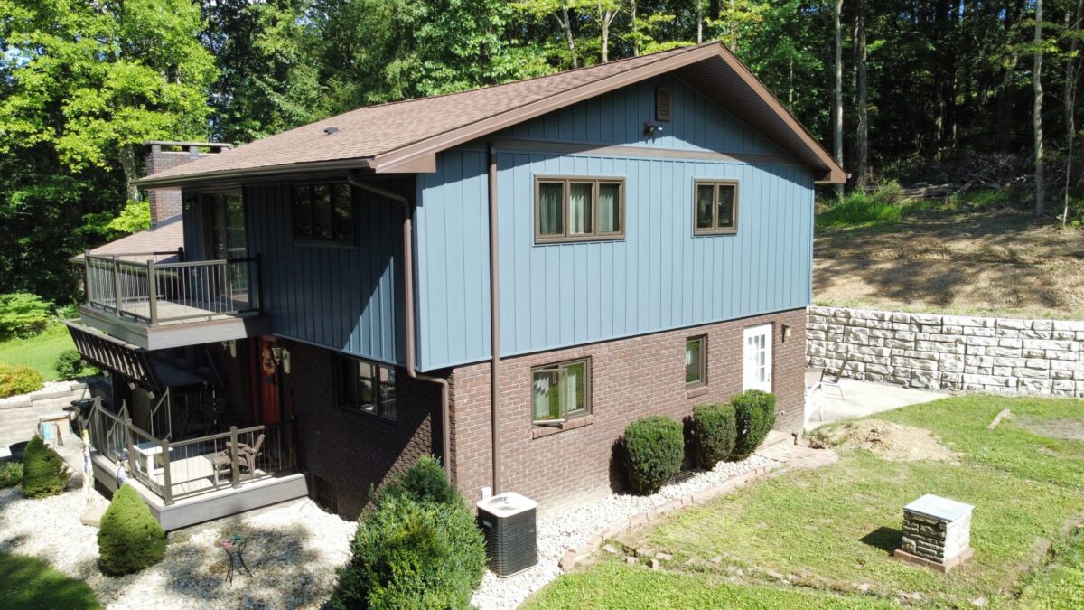 siding companies in Irwin light blue siding country house