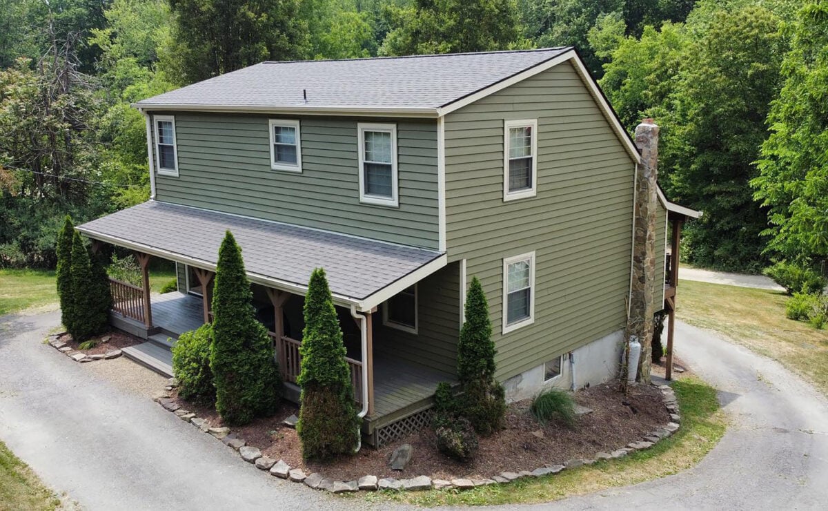 siding companies in Greensburg green house with grey shingles