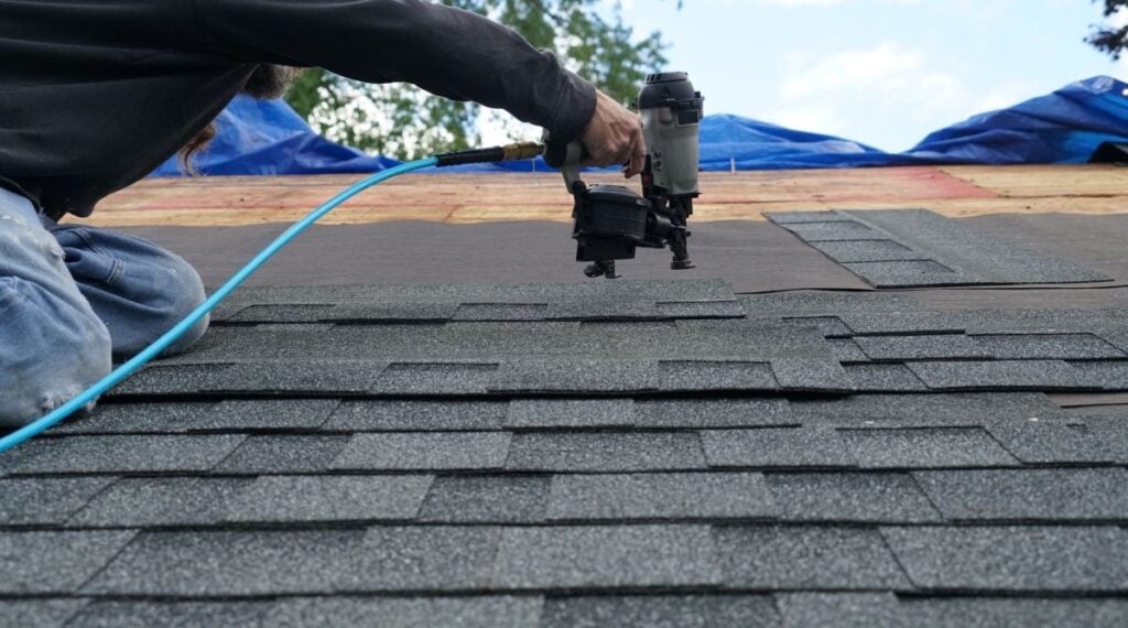 asphalt shingle roof being replaced