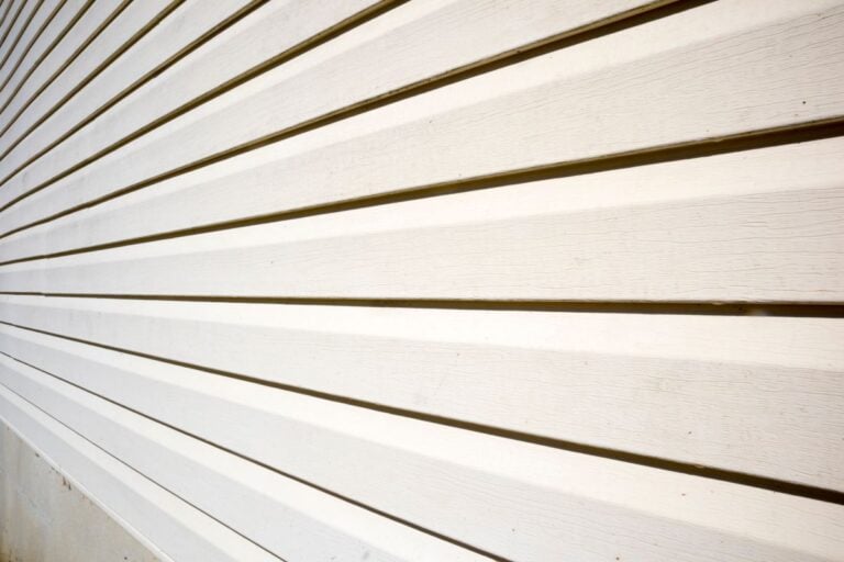 House with pale yellow vinyl siding, James Hardie Siding
