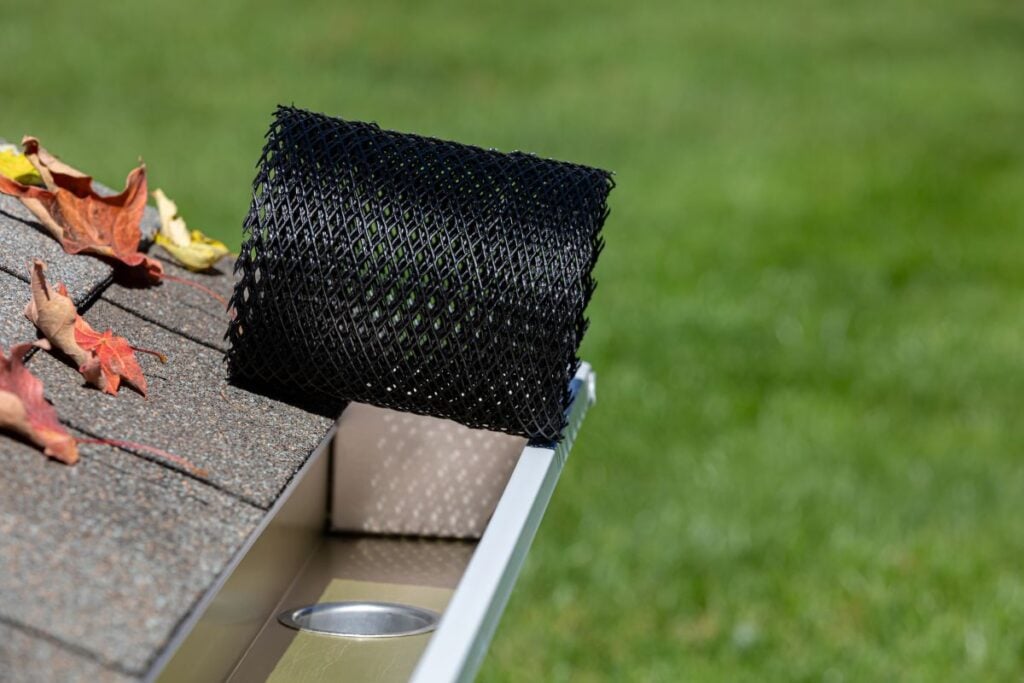a gutter guard being installed