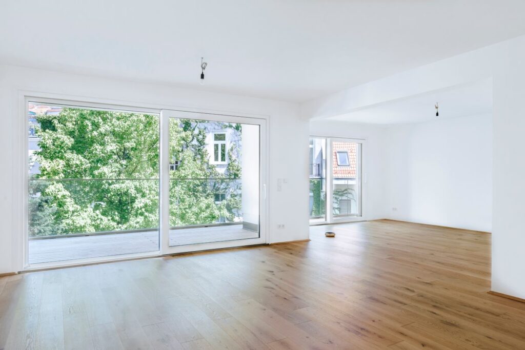large empty living room with big windows