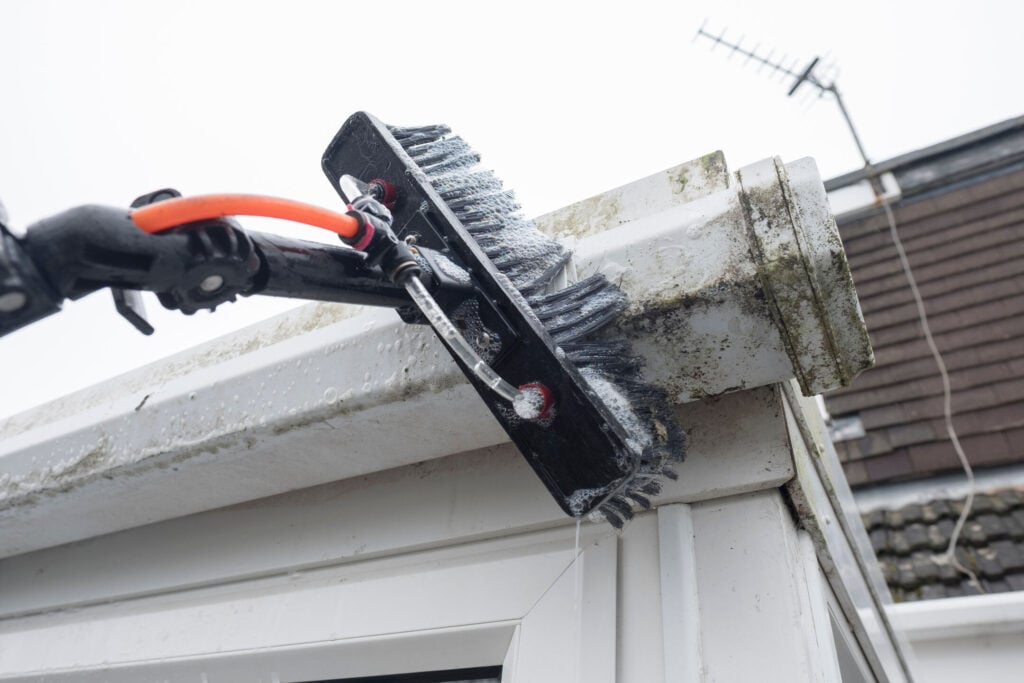 Cleaned white plastic pvc gutters and drain pipes that were blocked and full of green mould